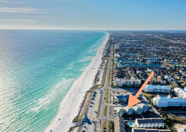 Talk about a prime location! You're steps away from soaking your toes in emerald waters and sugary white Miramar beach, directly across the street.