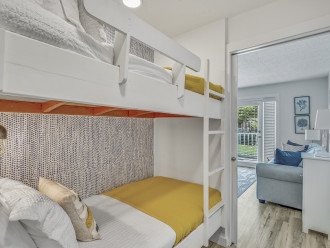 Hallway bunk beds off of the living room. Comfortable bedding, in-wall lighting, easy to use ladder right up to the top bunk. Pocket door for ample privacy and light control.