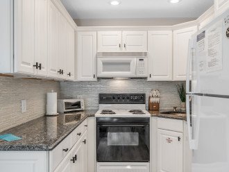 Fully equipped kitchen with modern accents throughout. Ample counter space to easily cook any meal. Kitchen has an oven, stove, microwave, toaster, freezer/fridge combo, Flex Brew coffee maker for gounds or Kureg cups and all necessary cooking utensils.
