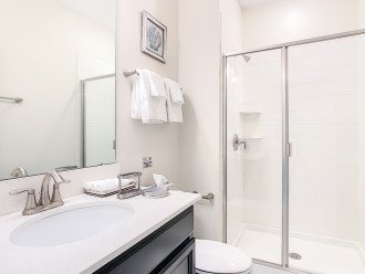 Clear and spacious bathroom with a walk-in shower