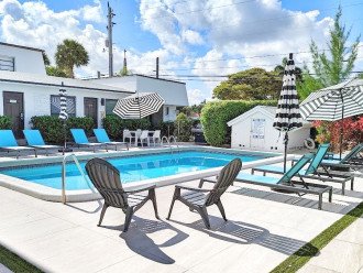 Back from the beach? Shower off by the pool house and relax on the pool deck.