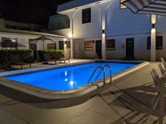 Alternative view of pool lit up at night.