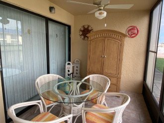 Dining and storage on lanai with Florida glass to use year-round