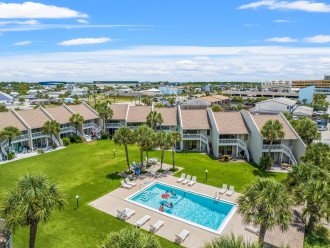 The community features a beautiful pool just steps away from the beach