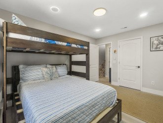 The spacious bunk room features a twin over queen bed, full bath and laundry room!