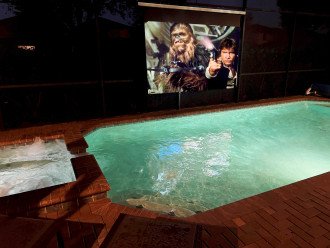Enjoy Movies Poolside on this 125" Screen and 5.1 Surround Sound