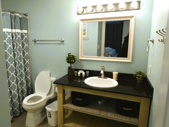 Full size vanity with hair dryer provided.