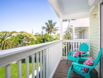 Enjoy the tropical view from the upstairs porch