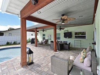 Tons of Outdoor Lounge Seating Under the Covered Patio with Surround Sound System & TV