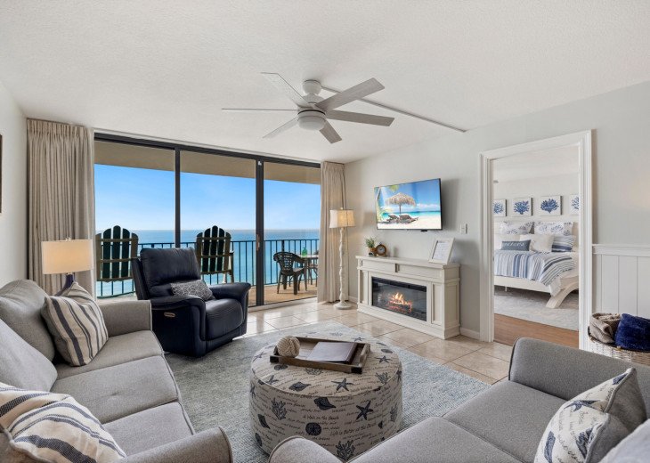 Settle back and relax on comfy living-room seating, including a recliner, and soak in the coastal vibe as you warm yourself by the electric fireplace.