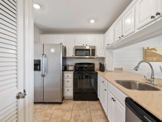 The fully equipped kitchen features all the standard major appliances – refrigerator, stove/oven, microwave, dishwasher.