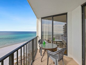 Enjoy hot beverages, cocktails, or a snack on the balcony’s petite table.