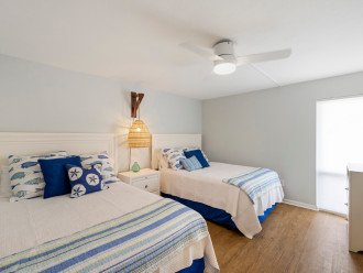 Discover the 2nd Bedroom with its 2 queen beds and ceiling fan.