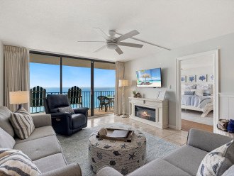 Settle back and relax on comfy living-room seating, including a recliner, and soak in the coastal vibe as you warm yourself by the electric fireplace.
