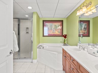 Master bathroom soaking tub and double sink vanity.