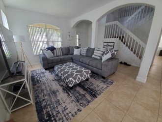 Downstairs family area with 70in TV and pull out sofa bed
