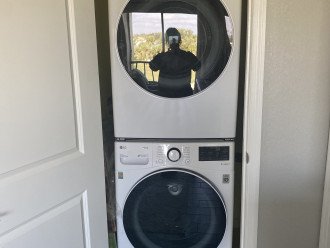 full size washer and dryer in primary bedroom