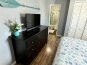 Dresser and TV plus bathroom in master bedroom #2