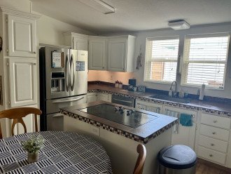 refrigerator and ample cabinets and counter space