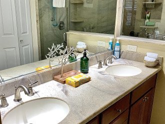 Master bathroom with his and her sinks, hand soap, make up remover and lotion