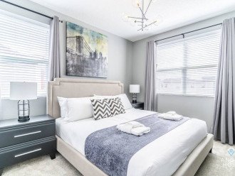 Bedroom 4 has a king bed & beautifully w/ slate gray accents. Shared bathroom with B3.