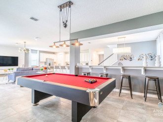 A mini pool hall! With barstools and darts too for you to enjoy anytime!