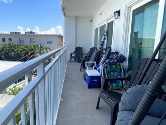 Large private balcony with seating for 6 and storage for beach gear which is pro