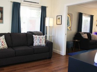 The den has a queen-sized sleeper couch with a 30oz alternative down mattress topper. It also features a granite blue, 6 drawer dresser, and a wall-mounted 40-inch Roku HDTV. Pocket doors are opened here but can be closed for complete privacy.