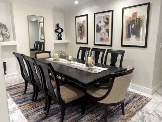 The dining room table can easily accommodate the whole group for a gourmet meal.