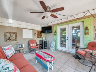 Lounge Space in Back Yard with wine/drink fridge and TV
