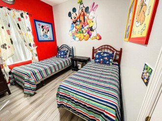 Bedroom 3 has twin beds and a Mickey Mouse theme