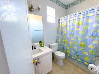 Third bathroom with shower over bath