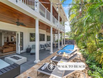 Quintessential Florida Keys style villa updated with modern fixtures, quaint breezy verandas, and towering ceilings. Unwind in the heated pool nestled in a tropical garden.