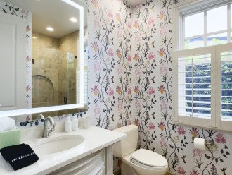 Downstairs bathroom features a walk-in shower and is conveniently located by the downstairs bedroom.