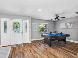The beautiful entry way of the house where you would see the living room right away! Play games and relax on your home away from home. Let us know what you think and send us an inquiry now!