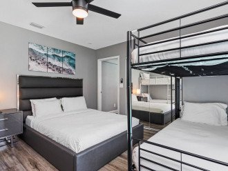 Comfortable bedroom with 2 single bunk beds, 1 queen sized bed, drawers, and smart TV. This room is great for family with kids or a group of friends. If you love what you see, send us an inquiry as soon as possible!