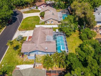 Aerial side view of our beautiful house showcasing our gorgeous heated pool. The property is surrounded by trees and is fully fenced. If you are interested in this property, send us an inquiry as soon as possible.
