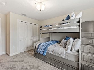 Family paradise with a luxury twin bed over full size bed bunk, with an additional trundle bed.