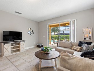 Cozy and spacious living area. The open floor plan seamlessly connects the living spaces, allowing for effortless flow and easy entertaining.