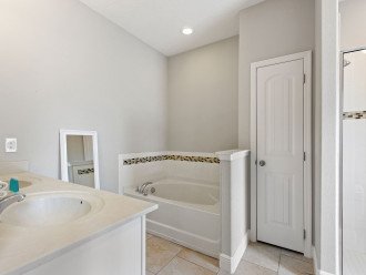 King bedroom's attached bathroom, large walk in shower dual sinks and garden tub