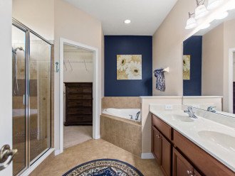 Private bathroom with large walk-in shower, oversize garden tub and walk in closet