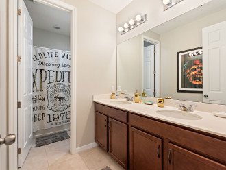 "Pirates" Adjacent themed bathroom, with twin sinks and shower over bath