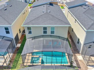Aerial view of the house, pool secured with screen