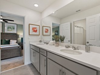 Adjacent bathroom with shower over bath