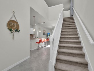 As you ascend the stairs, you'll discover the inviting loft area that awaits you