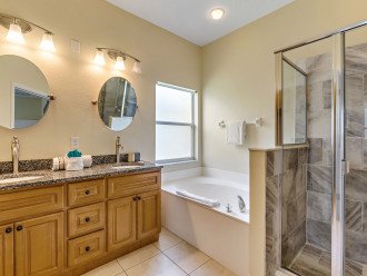 Bathroom with a large tub and separate shower