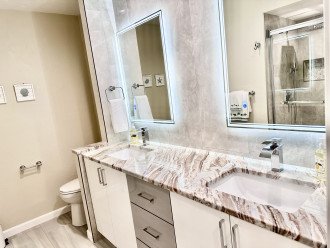 Dual Sinks with Granite Countertops and Lit/Anti Fog Mirrors in Master Bathroom