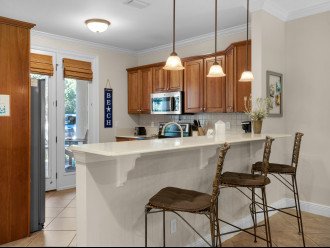 Open kitchen with breakfast bar seating