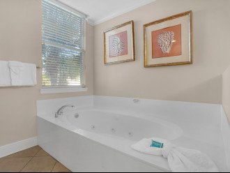 Primary bath with jacuzzi tub and walk in shower