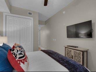Queen guest bedroom with wall mount TV